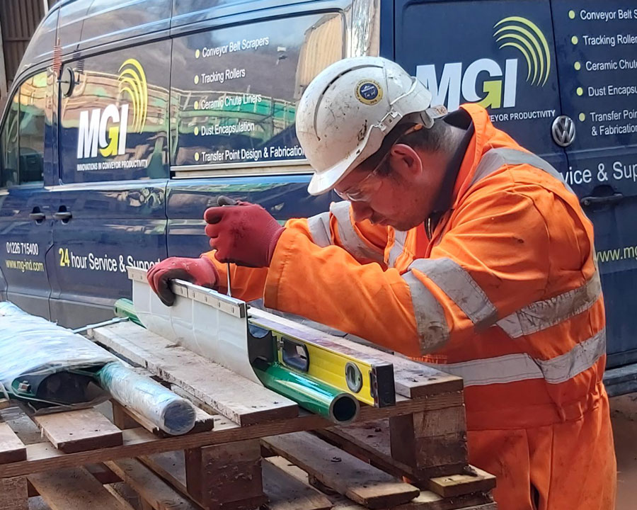man working on a conveyor belt